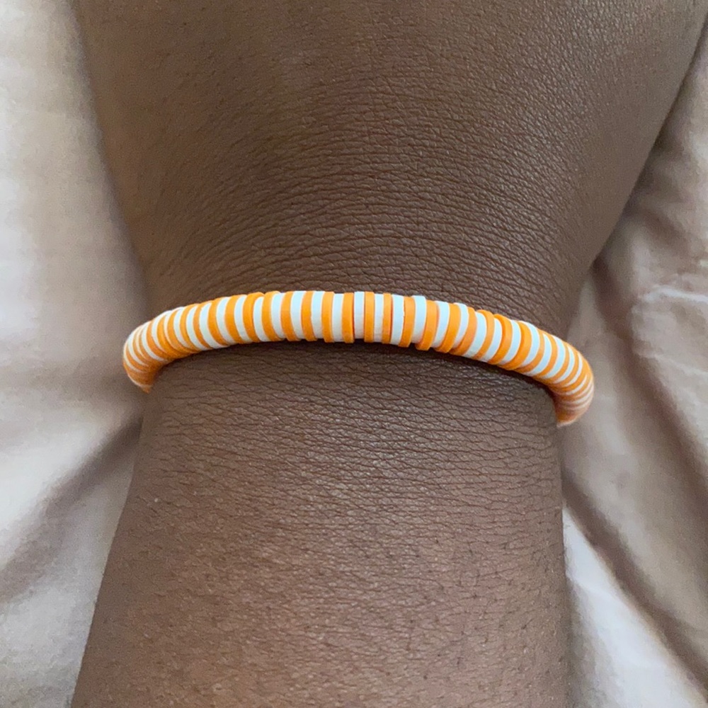 orange and white bracelet
